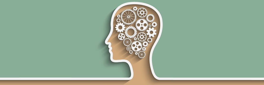 An illustrated silhouette of a human's head in profile, filled with cogs and gears